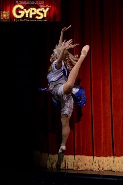 Dancer Heidi Friese on stage doing a leap as June Havoc in a stage production of Gypsy The Musical